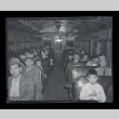 Large group of Japanese American people from Terminal Island fill a vehicle during 