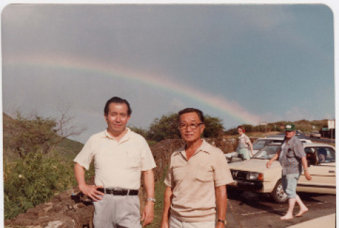 Two men standing with rainbow in back (ddr-ajah-2-14)