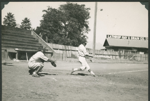 Two men playing baseball in field (ddr-densho-475-758)