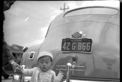 Child and automobile (ddr-densho-475-53)