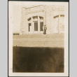 Man on steps outside stone building (ddr-densho-316-224)