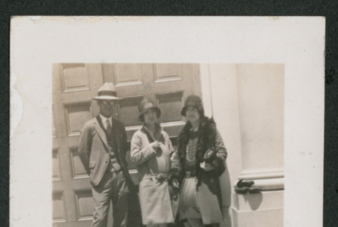 two women and one man outside (ddr-densho-378-772)