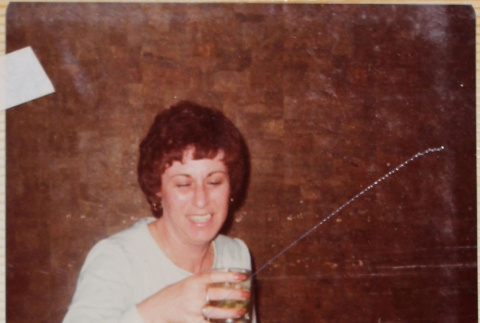 Margie Annala holding drink (ddr-densho-426-1314)