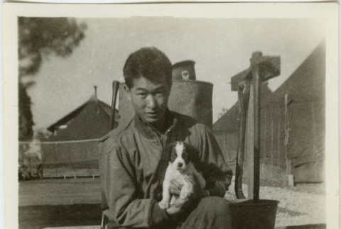 Soldier holding a puppy (ddr-densho-201-76)