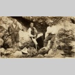 Three men resting on a rocky mountain side (ddr-njpa-1-2536)