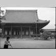Woman sweeping in front of temple (ddr-densho-426-2337)