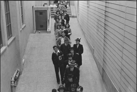 Japanese Americans waiting in line for inoculations (ddr-densho-151-131)