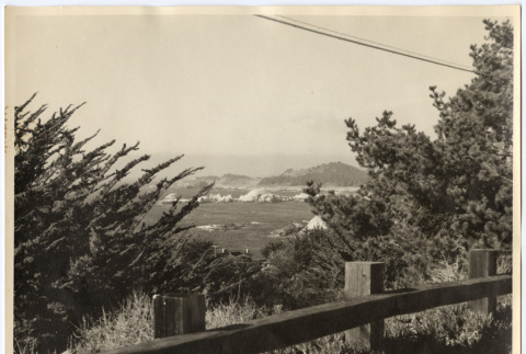 View of the coast from behind a fence (ddr-densho-542-844)