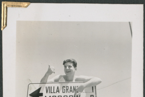 George Nelidov by sign near Russian River (ddr-densho-434-107)