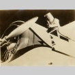 Wiley Post getting in/out of his plane in a pressurized suit (ddr-njpa-1-1322)