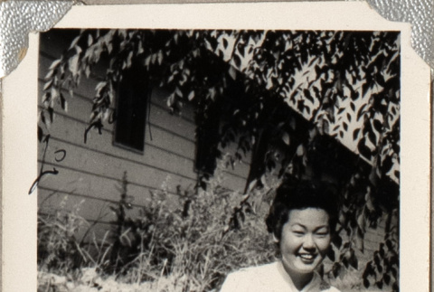 Woman sitting on lawn (ddr-densho-587-62)