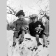 Two children sitting in the snow (ddr-densho-2-10)