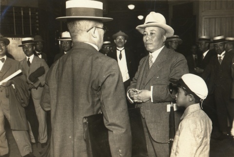 Seitoku Oshima,  imperial education administrator at Tokyo Station with his son (ddr-njpa-4-1622)