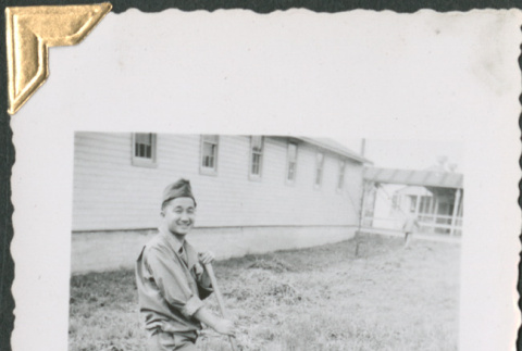 Man digging outside barracks (ddr-densho-434-160)