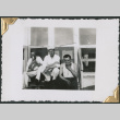 Three men sitting on steps eating (ddr-densho-434-226)