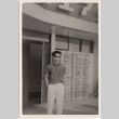 Man standing in front of business (ddr-densho-426-91)