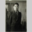 Man in suit and overcoat (ddr-densho-252-34)