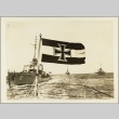 Photo of a flag on a Nazi ship, with other ships in the background (ddr-njpa-13-981)