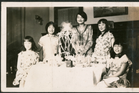 Five girls around table with decorations (ddr-densho-293-112)