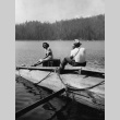 A man taking a photograph of Alice Abe on Lake Sequoia (ddr-densho-336-30)