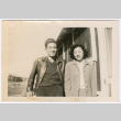 Couple poses outside barracks (ddr-densho-368-521)
