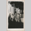 Group of people on a porch (ddr-manz-10-100)