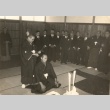 A sumo wrestler surrounded by others at a ceremony (ddr-njpa-4-2152)
