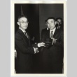 Man handing out award to Fred Suginoto (ddr-jamsj-1-642)