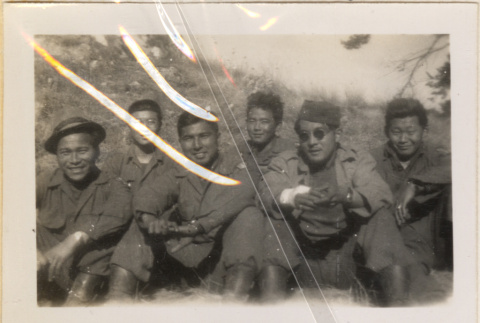 Six soldiers sitting on hillside (ddr-densho-466-245)
