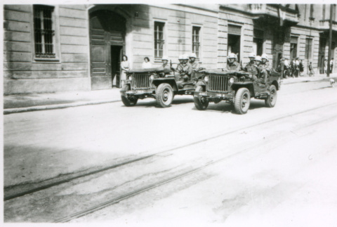 Two cars filled with soldiers (ddr-densho-1007-868)