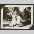 two women in front of a large tree (ddr-densho-378-603)