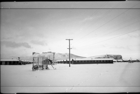 Block 21 with a snowy Castle Rock in the background (ddr-densho-570-42)