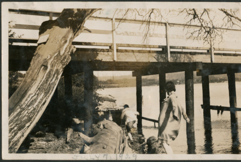 Two people under pier (ddr-densho-316-247)