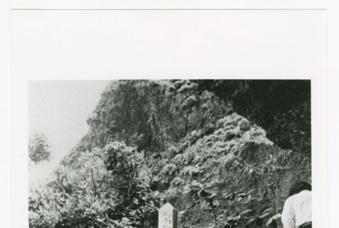 Shoichiro Ishihara placing offering at battle monument on Okinawa (ddr-densho-1007-110)