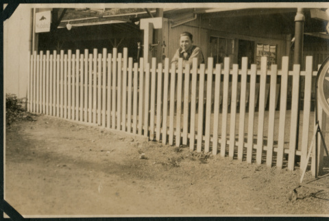 Man leaning on fence (ddr-densho-359-513)