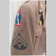 Close up of shoulder of military jacket with Go For Broke insignia (ddr-densho-539-147)