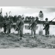 Soldiers holding rifles on a riverbank (ddr-densho-22-465)
