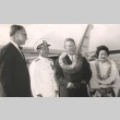 Hayato Ikeda and wife posing with captain and another man outside airplane (ddr-njpa-4-157)