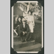 man and two women sitting on steps (ddr-densho-378-554)