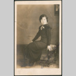 Portrait of woman on bench (ddr-densho-316-218)