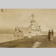 Sailors standing on a dock with a naval ship arriving (ddr-njpa-1-1594)