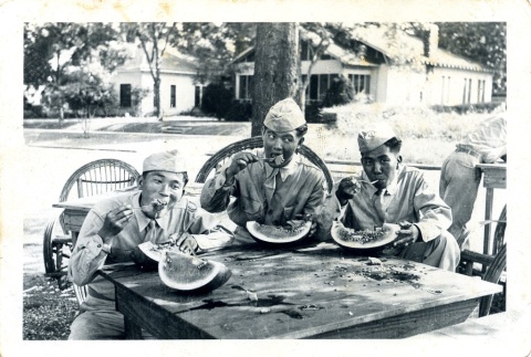 Three soldiers eating watermelon (ddr-densho-22-305)