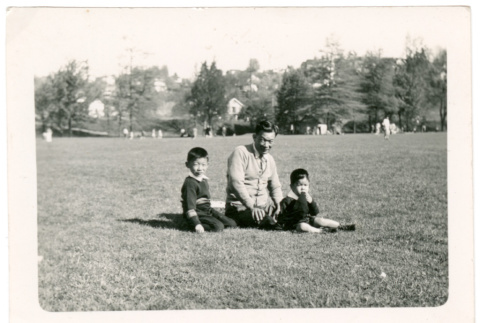Man with two boys at park (ddr-densho-430-162)