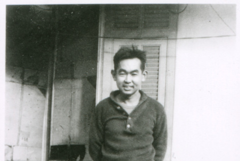 Man outdoors in sweater (ddr-densho-1007-852)