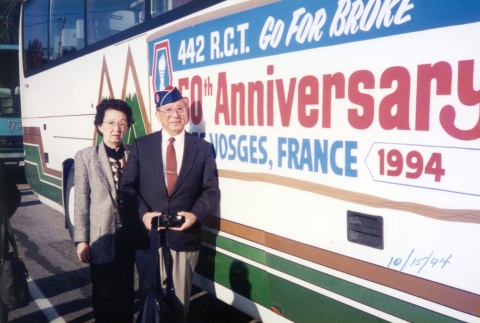 Nisei couple in front of tour bus (ddr-densho-105-16)