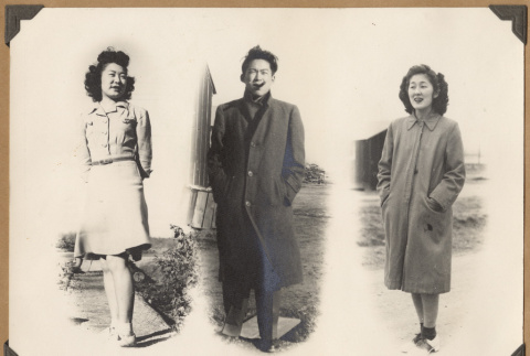 Three people standing (ddr-densho-542-58)