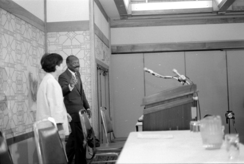 Two behind podium (ddr-densho-1007-508)