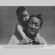 Man and child at Manzanar incarceration camp (ddr-csujad-7-8)