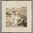 Two men sitting in a field (ddr-densho-433-1109)