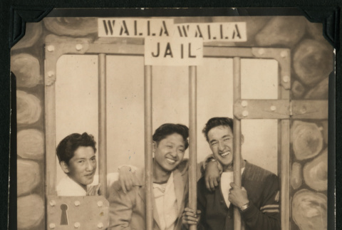 Walter Matsuoka and two companions jokingly pose in a Walla Walla Jail mock up (ddr-densho-390-70)
